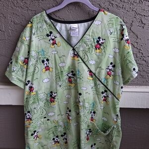 VTG Disney Green Apparel with Mickey Mouse Design.
